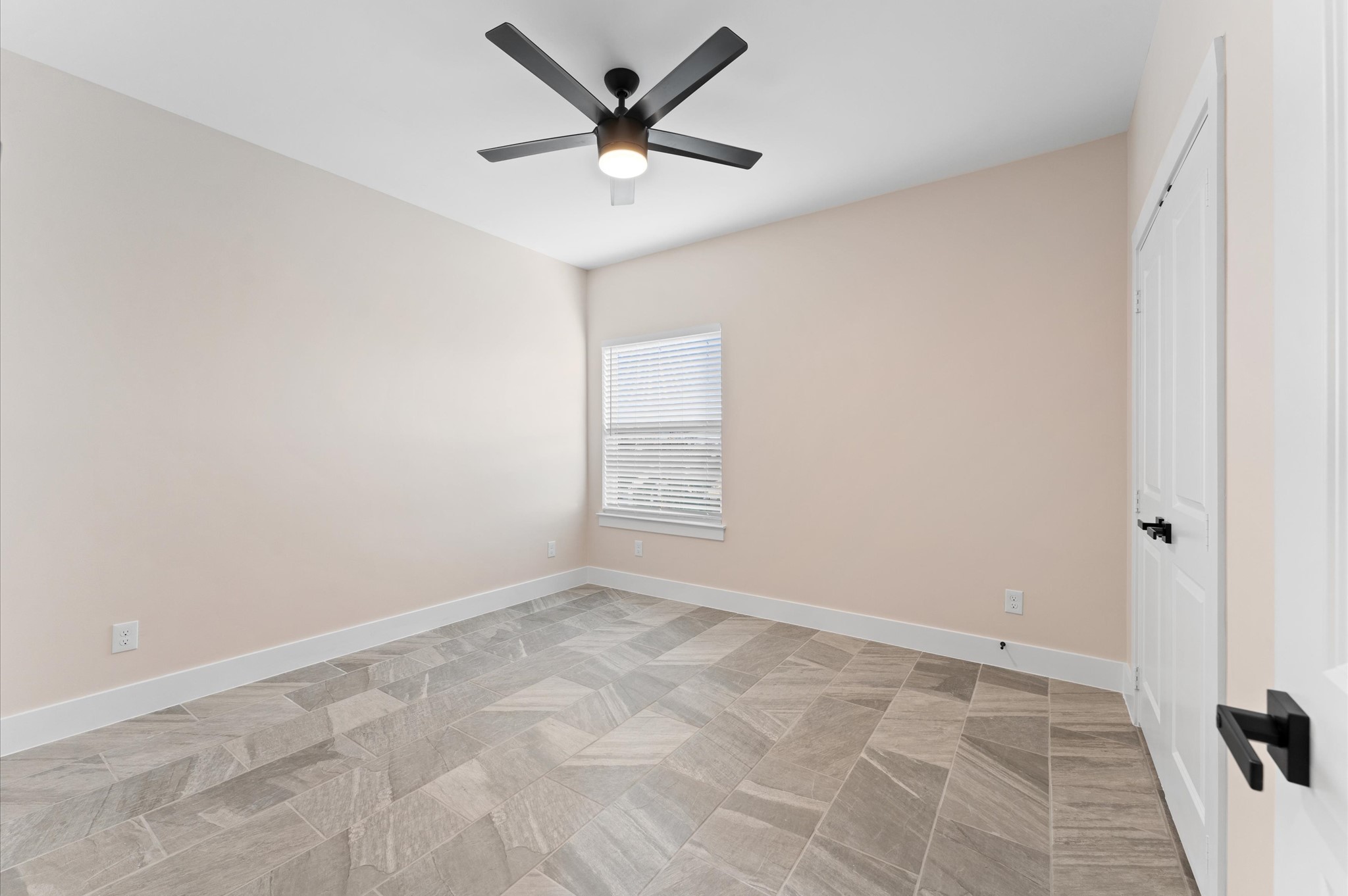 1908 Dismuke Street, Unit A Houston, TX 77023 - Photo 27 of 42 an empty room with a ceiling fan and window