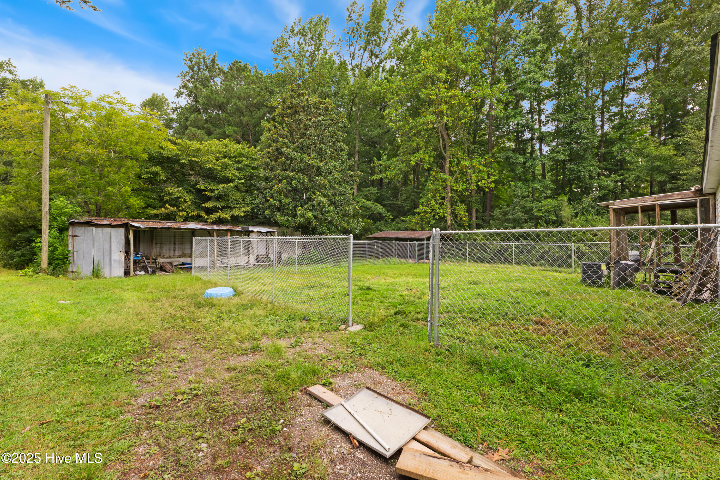 1461 Core Point Road Blounts Creek, NC 27814 - Photo 27 of 37 Backyard w/Fence