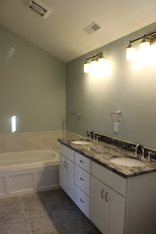 2 Silverbirch Road Billerica, MA 01821 - Photo 11 of 24 a bathroom with a granite countertop sink a toilet and bathtub