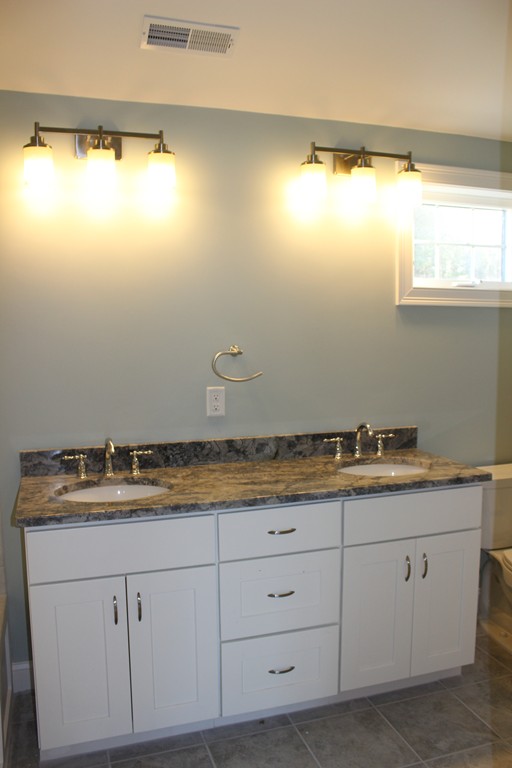 2 Silverbirch Road Billerica, MA 01821 - Photo 12 of 24 a bathroom with a granite countertop sink and a window