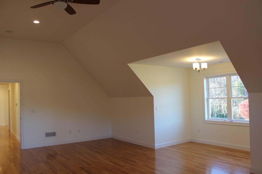 2 Silverbirch Road Billerica, MA 01821 - Photo 15 of 24 an empty room with wooden floor and windows