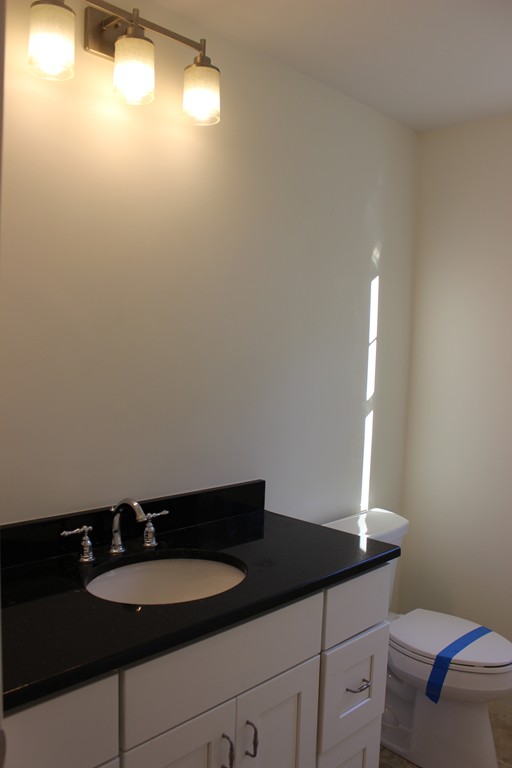 2 Silverbirch Road Billerica, MA 01821 - Photo 19 of 24 a bathroom with a sink and a mirror