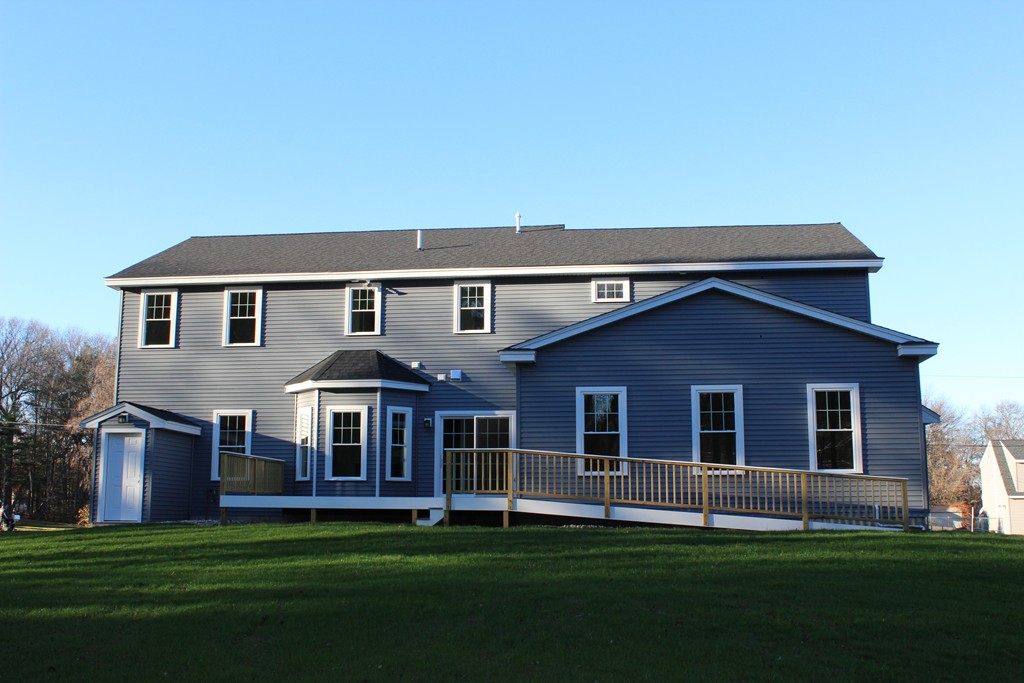 2 Silverbirch Road Billerica, MA 01821 - Photo 22 of 24 a front view of a house with a garden
