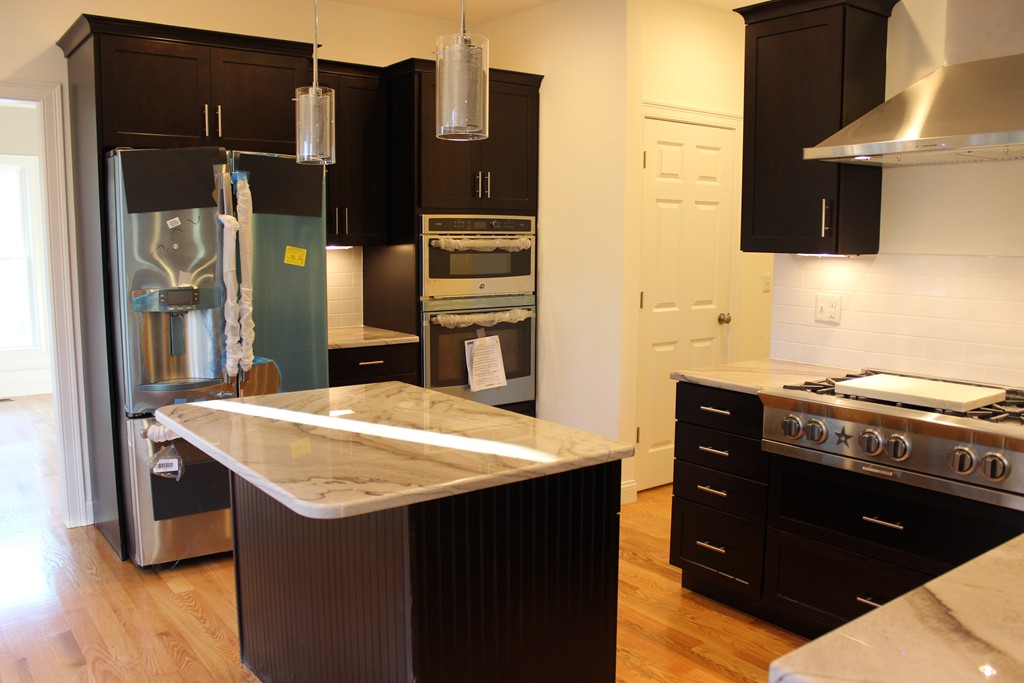 2 Silverbirch Road Billerica, MA 01821 - Photo 5 of 24 a kitchen with a stove and a refrigerator