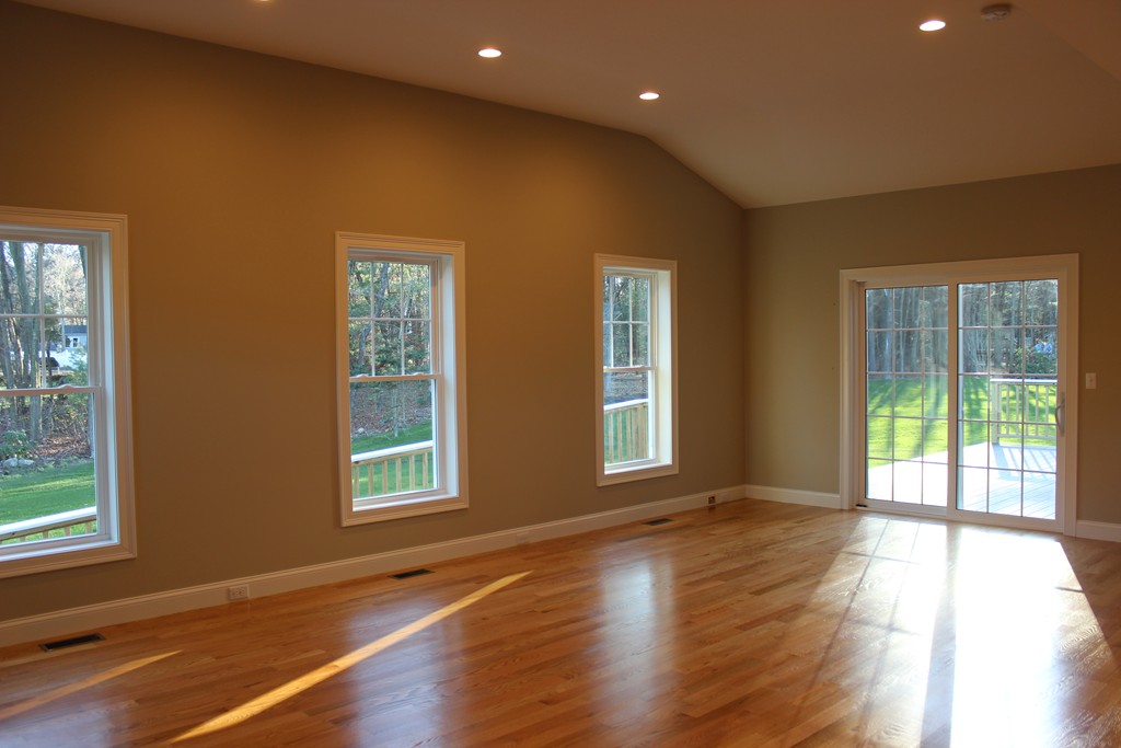 2 Silverbirch Road Billerica, MA 01821 - Photo 8 of 24 a view of an empty room with wooden floor and a window