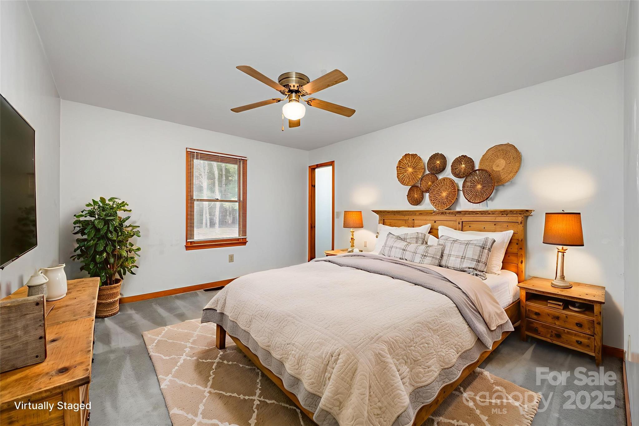 9595 Mt Olive Road Mount Pleasant, NC 28124 - Photo 12 of 26 a bedroom with a bed and a chandelier