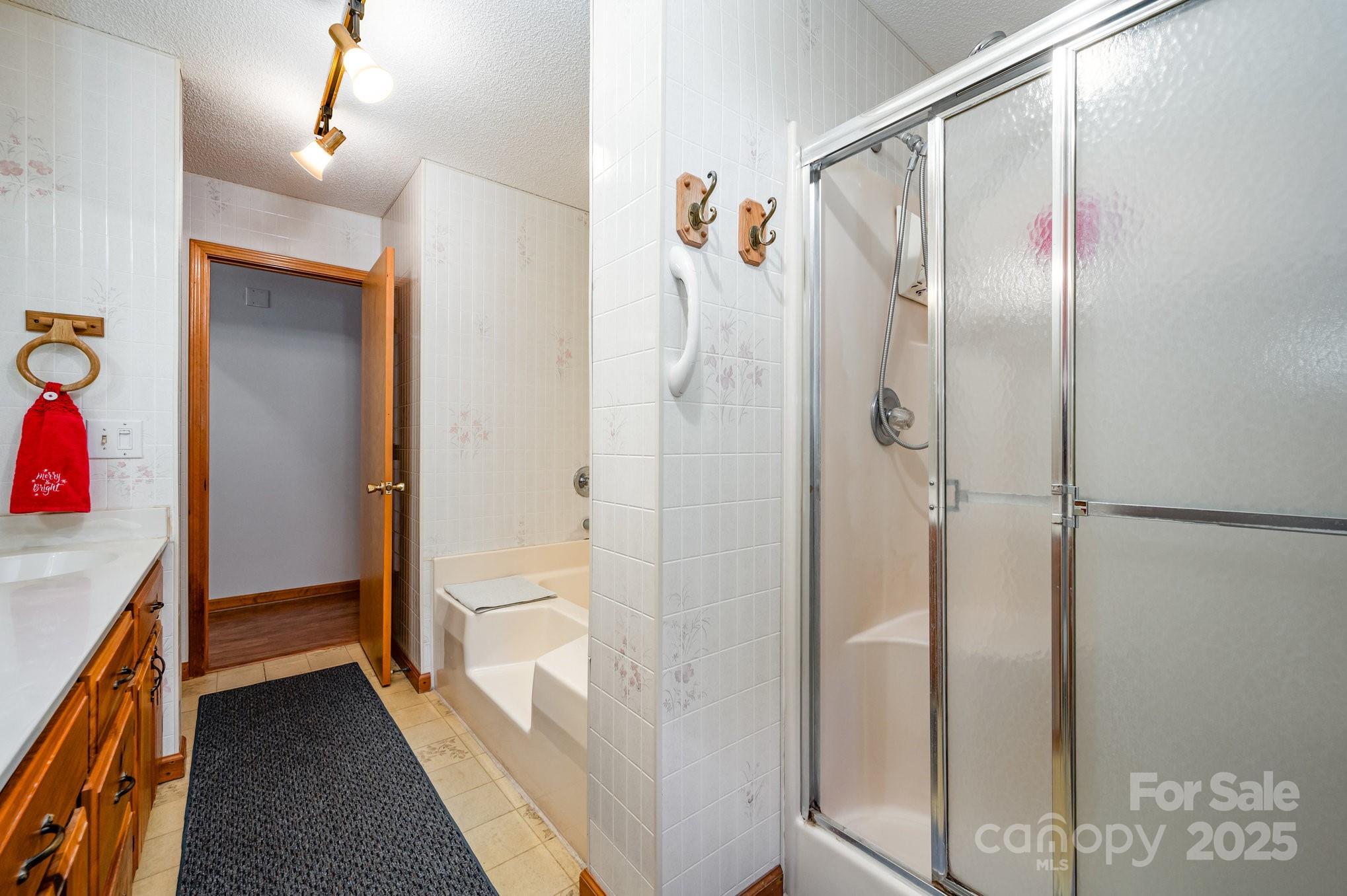 9595 Mt Olive Road Mount Pleasant, NC 28124 - Photo 14 of 26 a bathroom with a shower and a sink