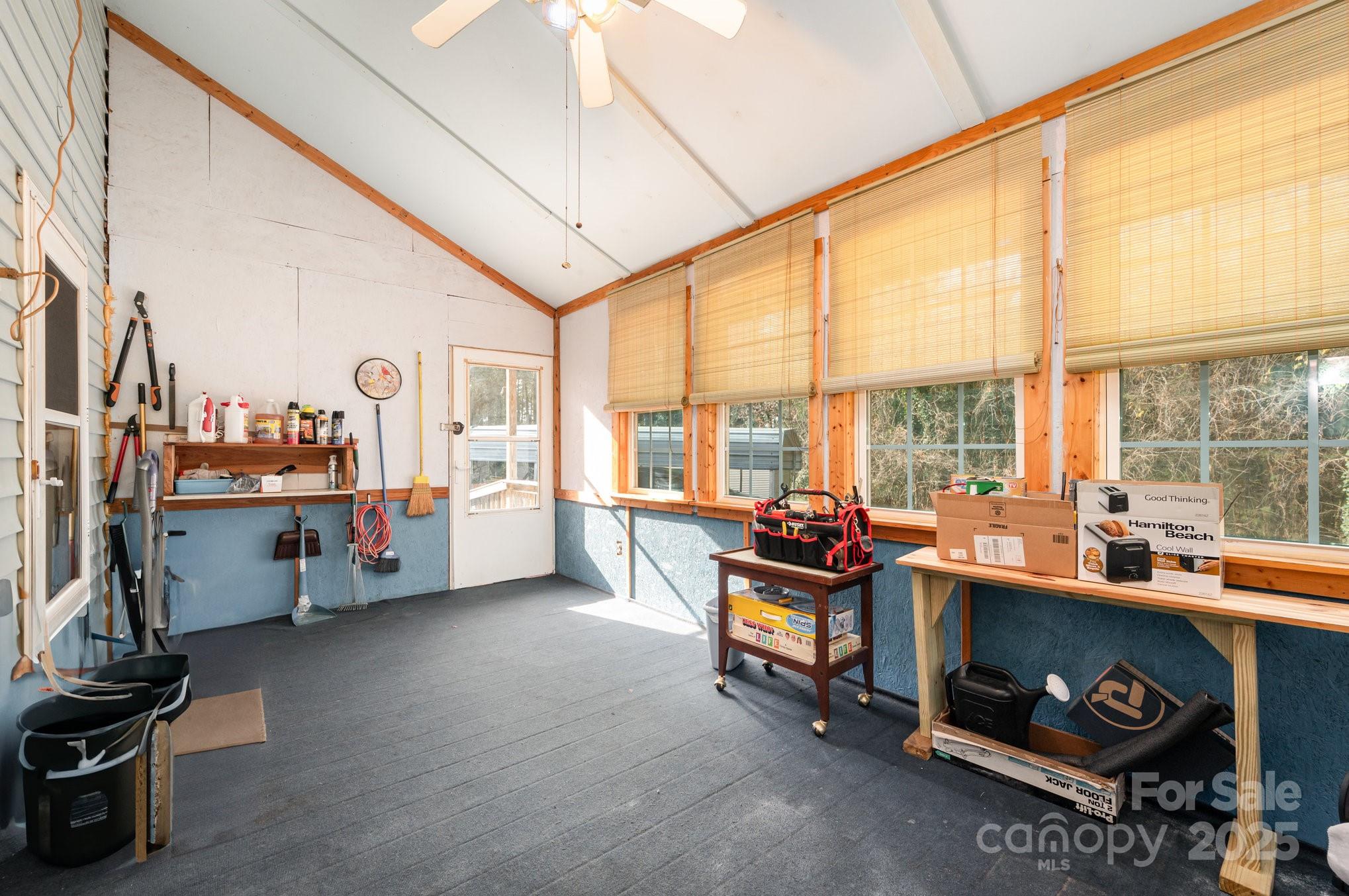 9595 Mt Olive Road Mount Pleasant, NC 28124 - Photo 17 of 26 a living room with furniture and a floor to ceiling window