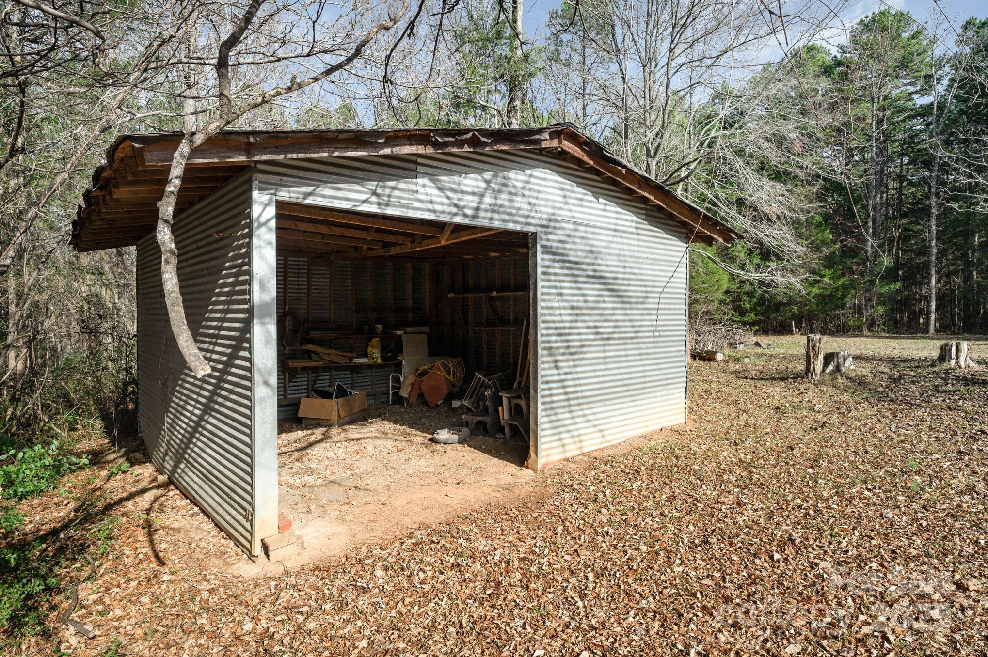 9595 Mt Olive Road Mount Pleasant, NC 28124 - Photo 19 of 26 a view of wooden house with a yard