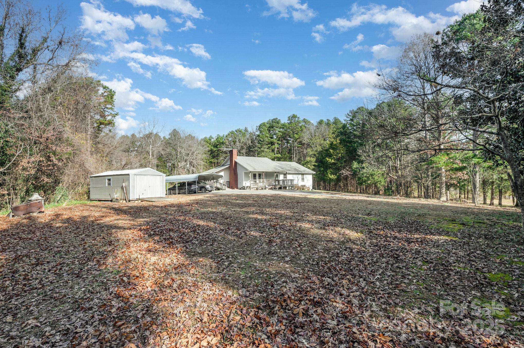 9595 Mt Olive Road Mount Pleasant, NC 28124 - Photo 20 of 26 a view of a house with a yard