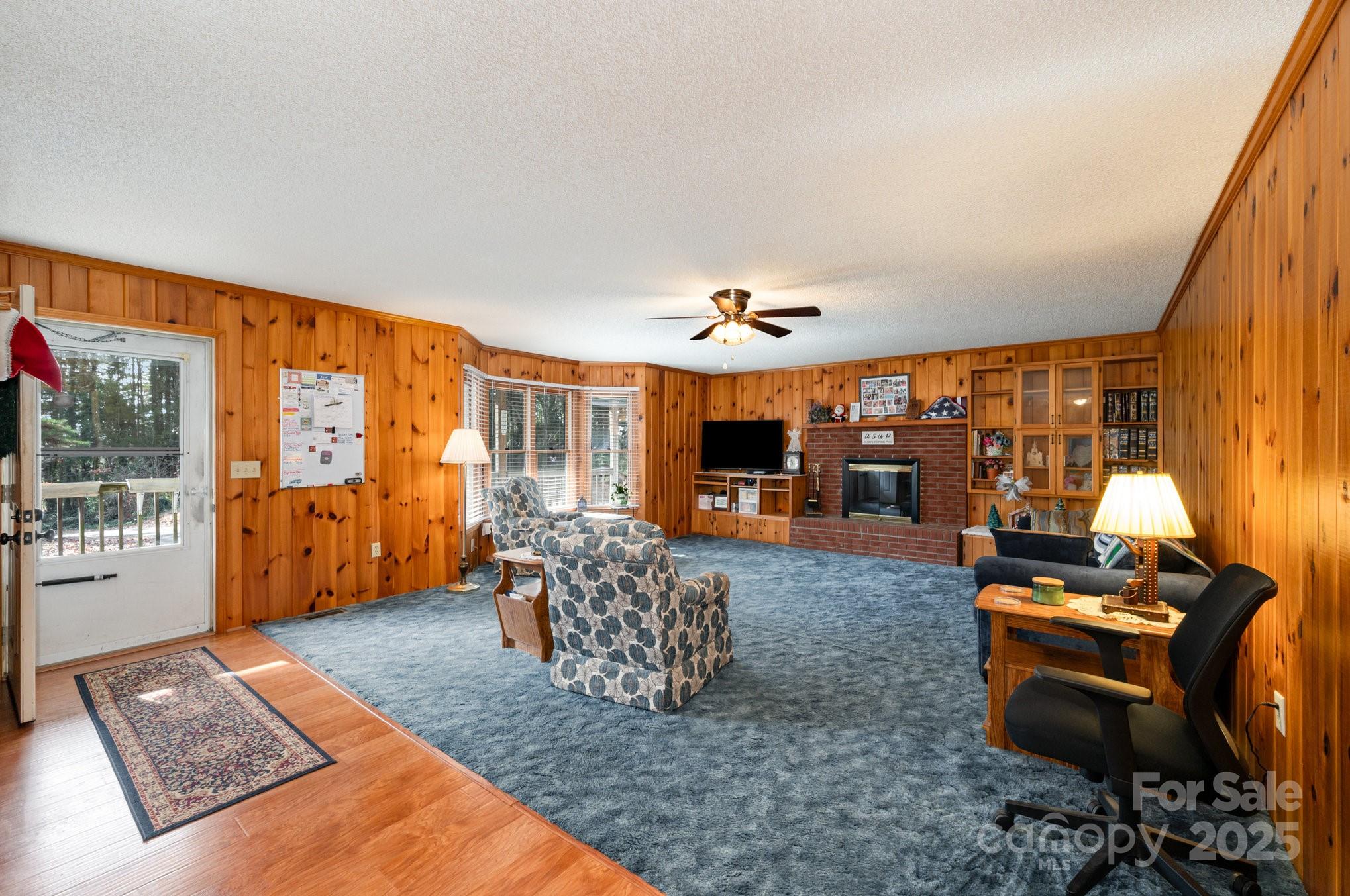 9595 Mt Olive Road Mount Pleasant, NC 28124 - Photo 2 of 26 a living room with furniture and a flat screen tv