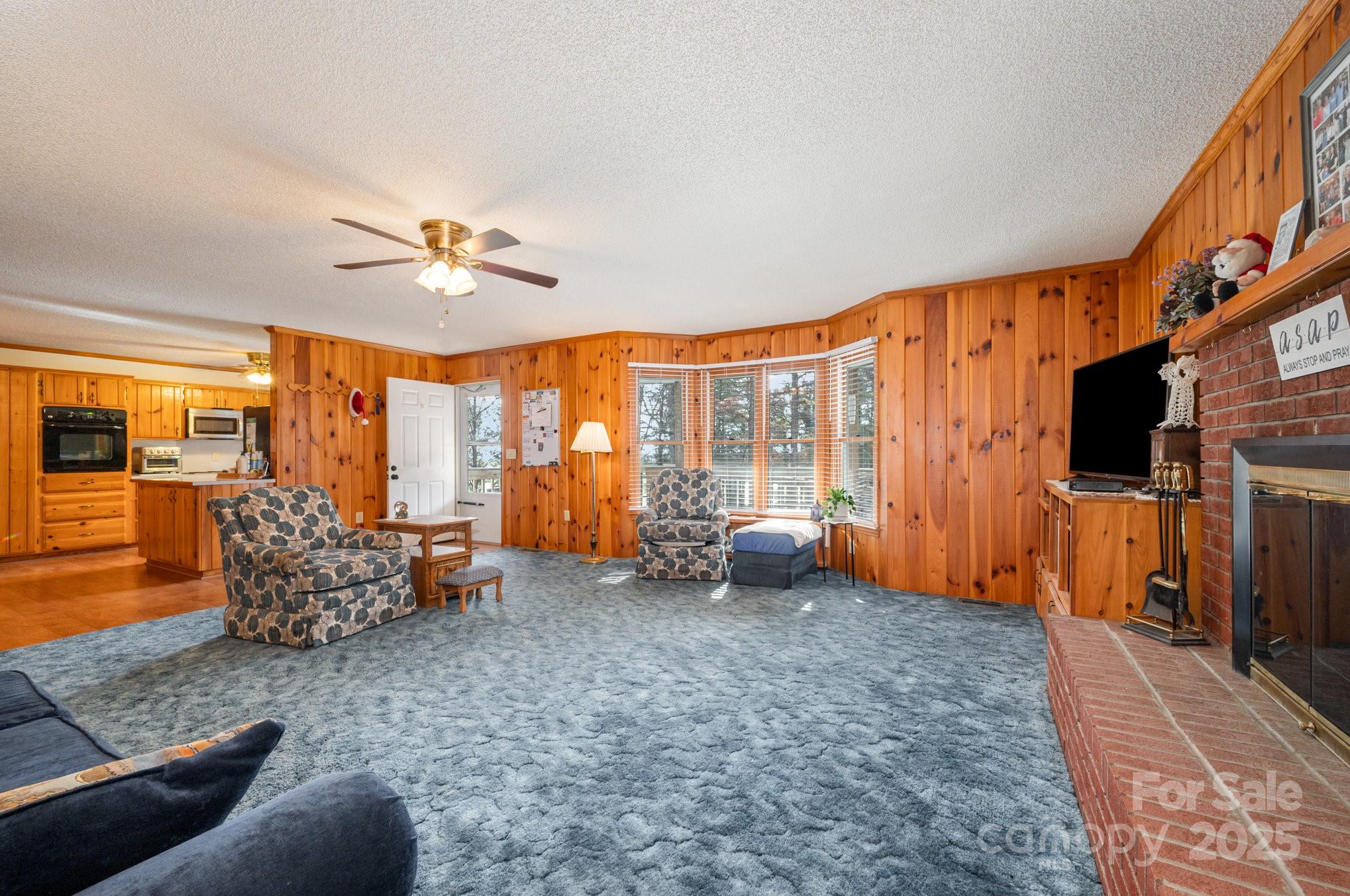 9595 Mt Olive Road Mount Pleasant, NC 28124 - Photo 4 of 26 a view of living room filled with furniture and a flat screen tv