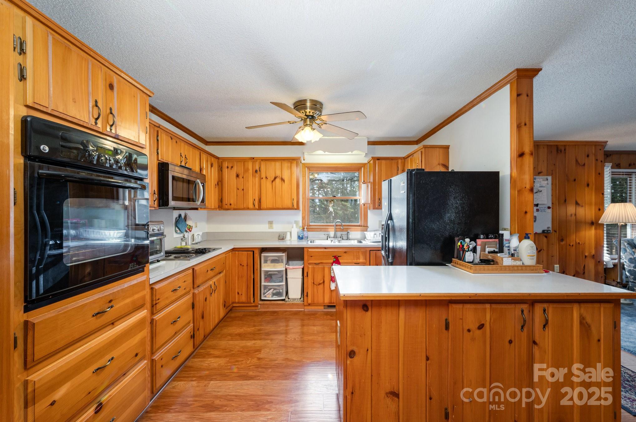 9595 Mt Olive Road Mount Pleasant, NC 28124 - Photo 5 of 26 a kitchen with stainless steel appliances kitchen island granite countertop a stove and a microwave