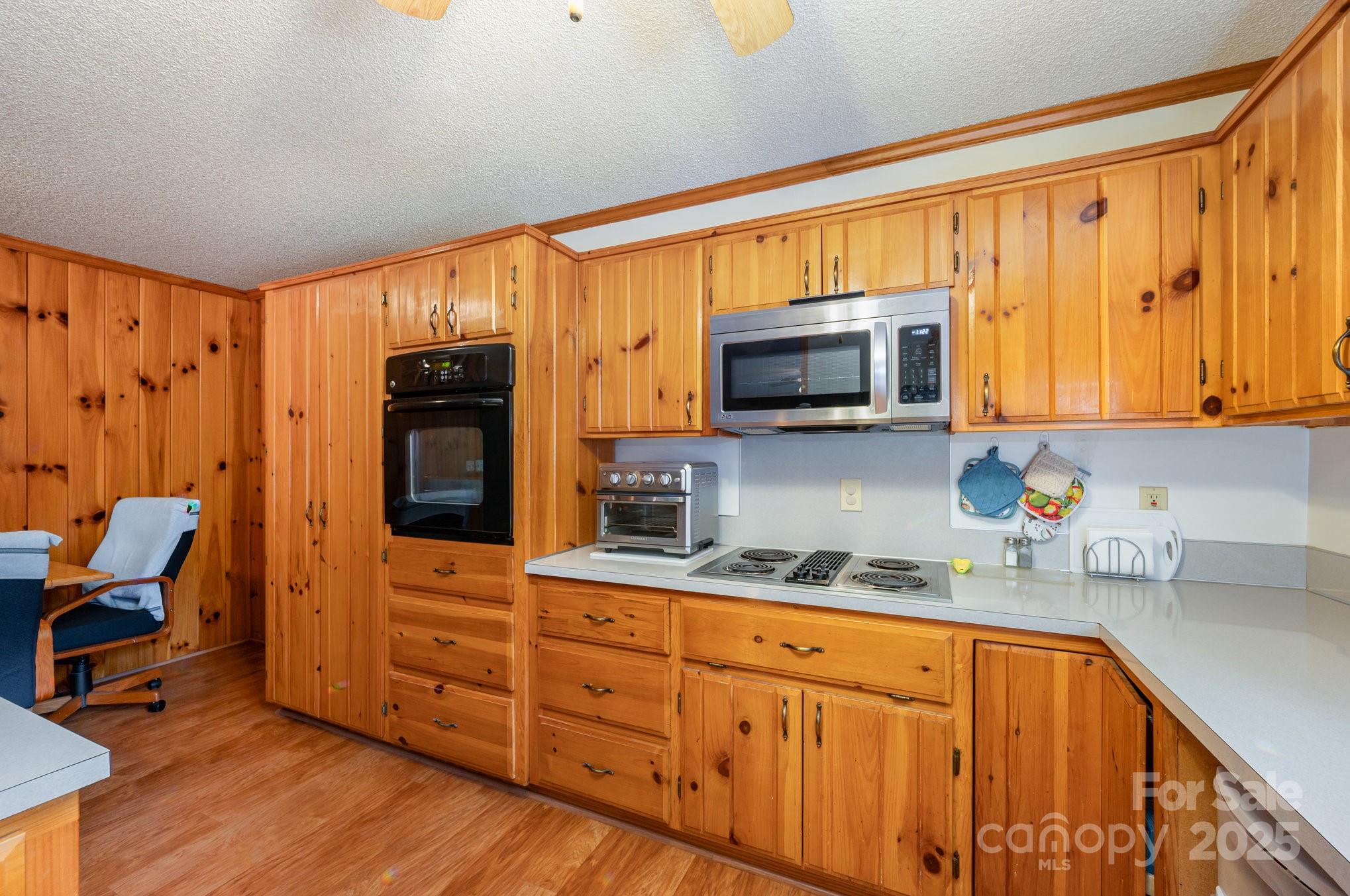 9595 Mt Olive Road Mount Pleasant, NC 28124 - Photo 6 of 26 a kitchen with stainless steel appliances granite countertop a stove a sink and a microwave