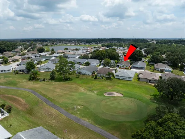 a view of a golf course with a swimming pool