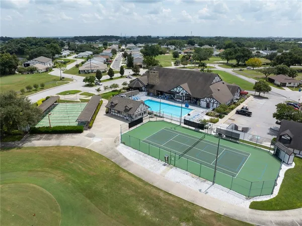 an aerial view of a house with outdoor space