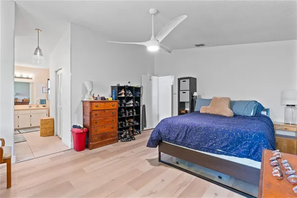 a bedroom with a bed and dresser