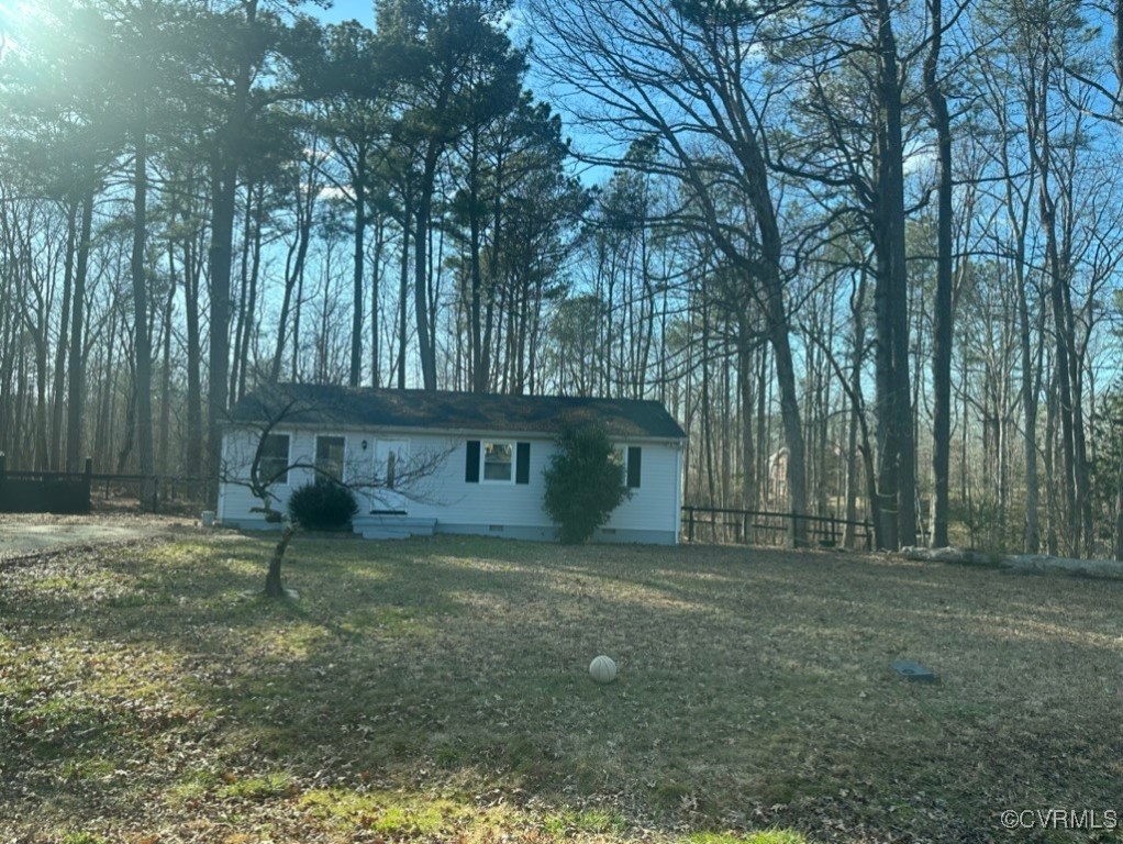 15810 Saddlebrook Road Chesterfield, VA 23838 - Photo 9 of 9 a view of a yard with large trees and wooden fence