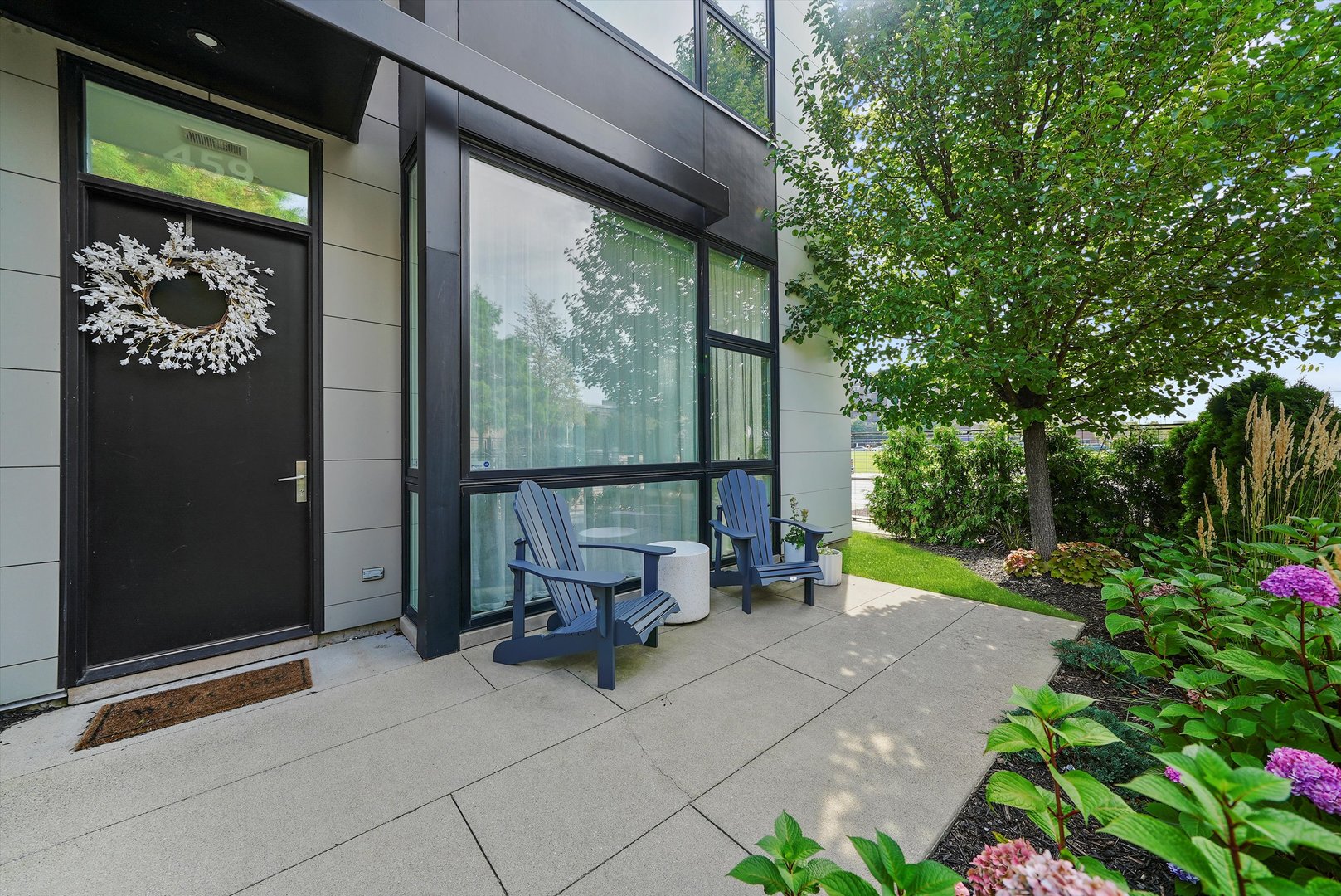 459 West Hobbie Street Chicago, IL 60610 - Photo 2 of 47 a view of a porch with furniture and garden