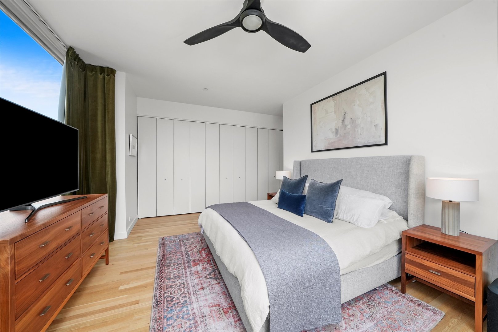 459 West Hobbie Street Chicago, IL 60610 - Photo 25 of 47 a bedroom with a bed and a flat screen tv