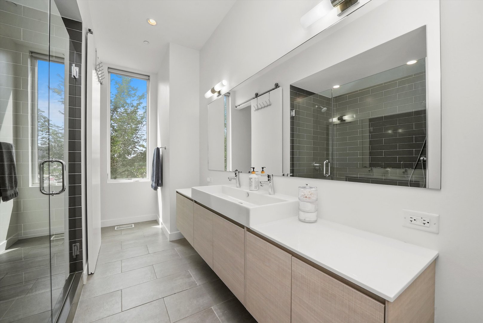 459 West Hobbie Street Chicago, IL 60610 - Photo 26 of 47 a bathroom with a double vanity sink mirror and shower