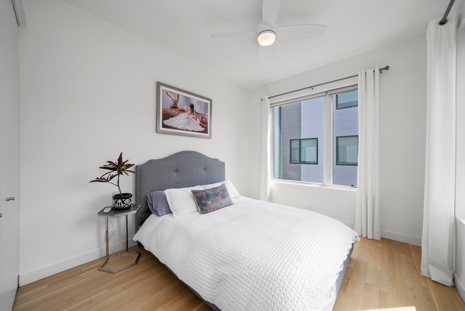 459 West Hobbie Street Chicago, IL 60610 - Photo 28 of 47 a bedroom with a bed and a window