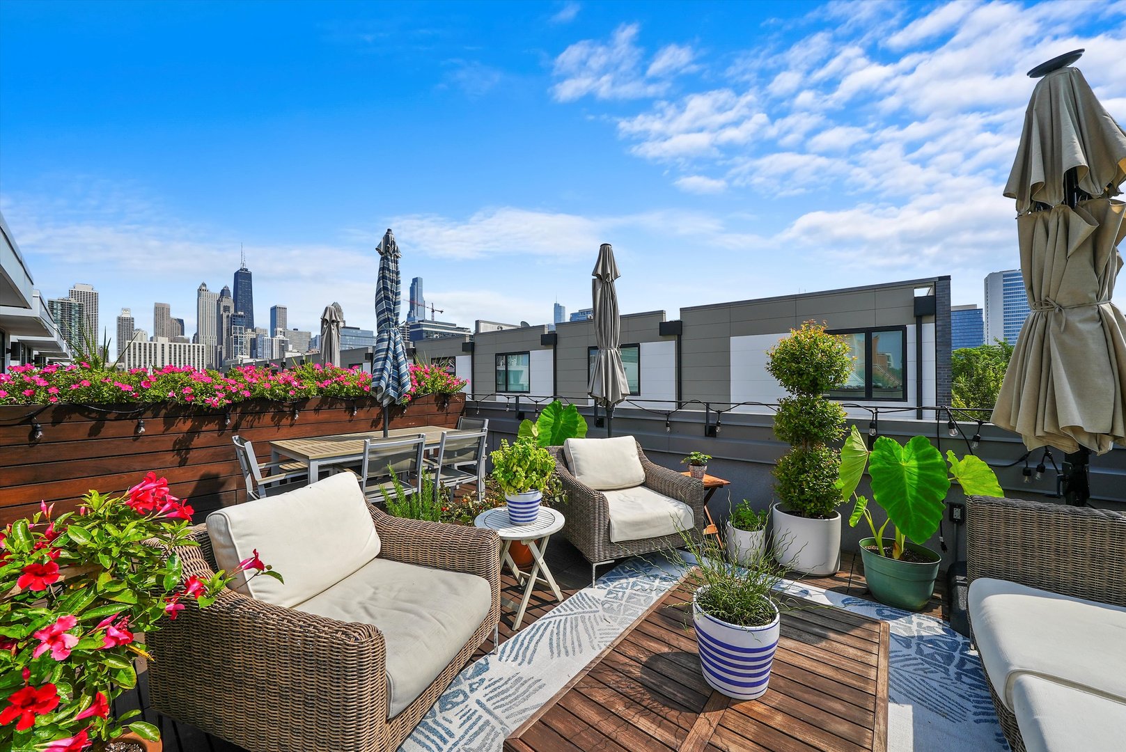 459 West Hobbie Street Chicago, IL 60610 - Photo 31 of 47 a view of a patio with couches and table and chairs and potted plants