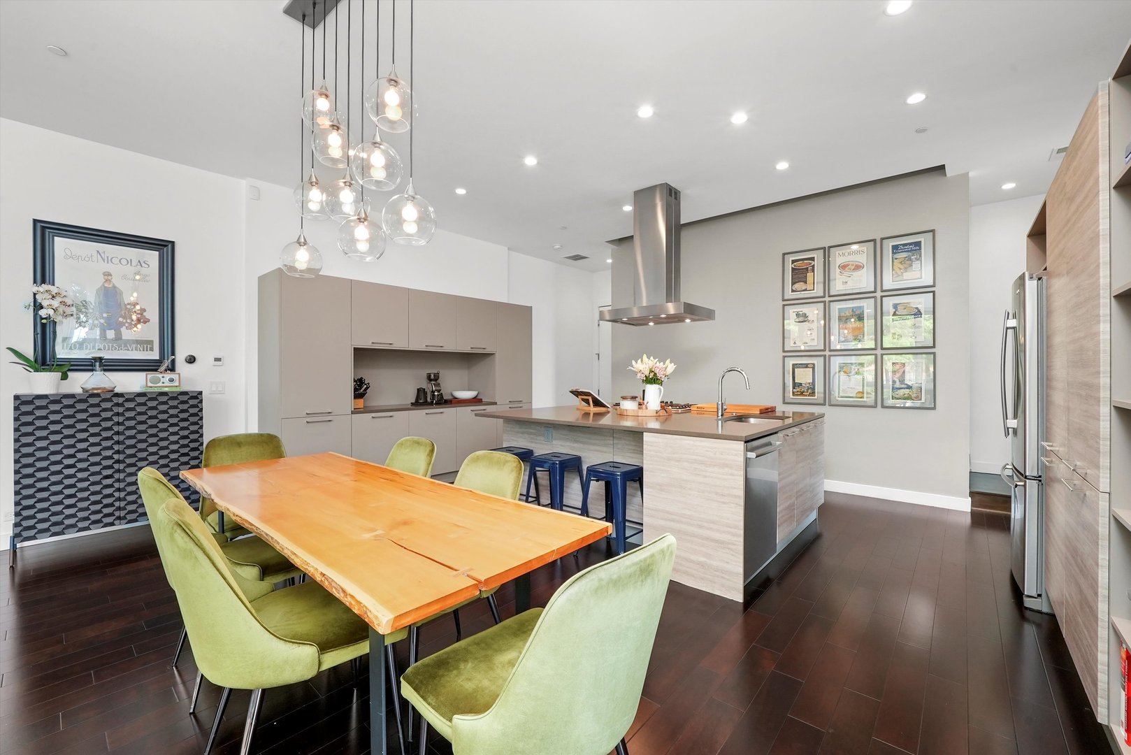 459 West Hobbie Street Chicago, IL 60610 - Photo 10 of 47 a room with stainless steel appliances kitchen island a table and chairs in it