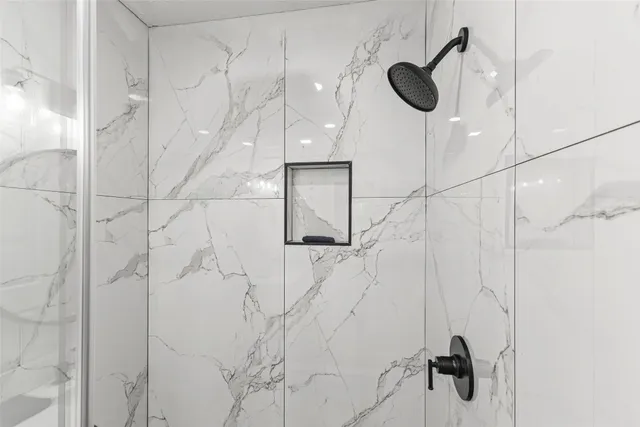 a bathroom with a sink vanity mirror and toilet