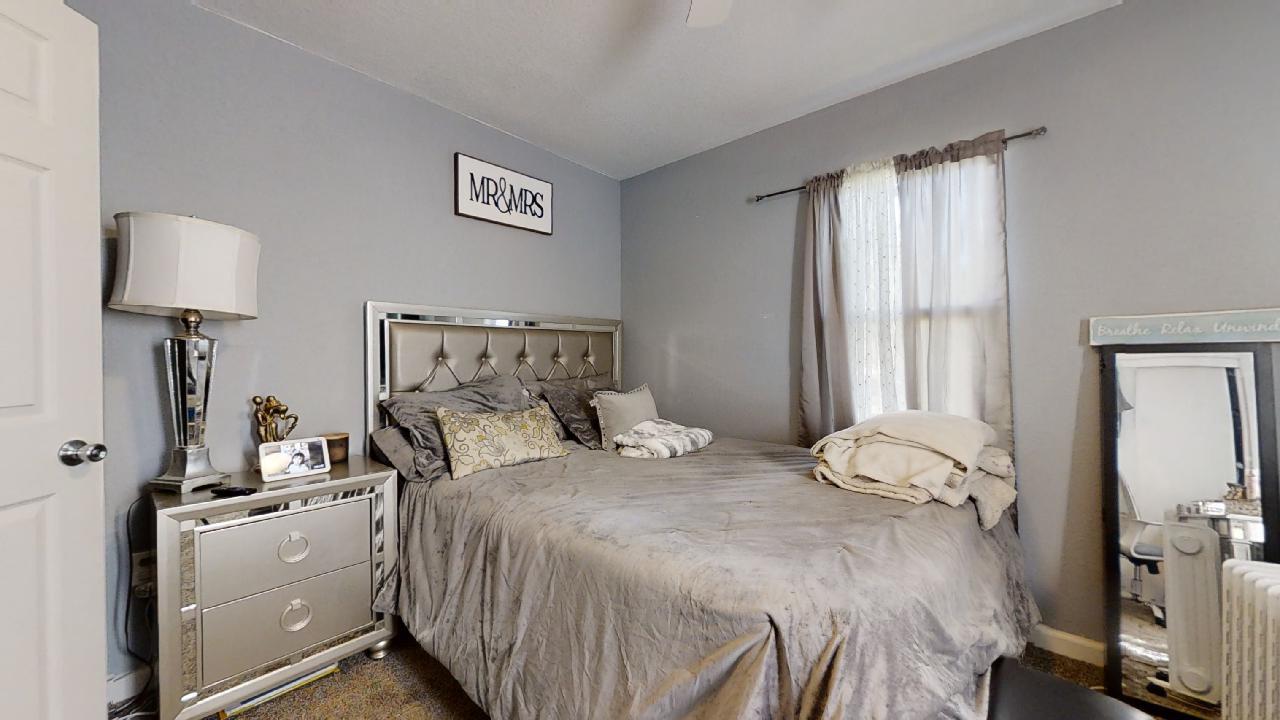 1124 West Cushing Street Decatur, IL 62526 - Photo 13 of 31 a bedroom with a bed and a lamp