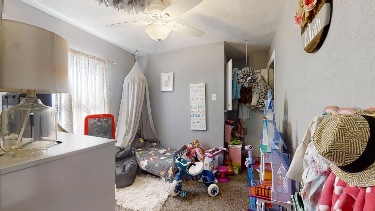 1124 West Cushing Street Decatur, IL 62526 - Photo 15 of 31 a room with gym equipment and a mirror