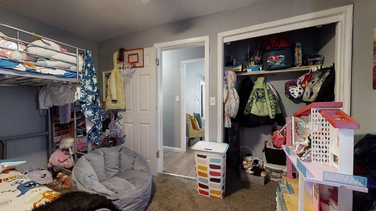 1124 West Cushing Street Decatur, IL 62526 - Photo 21 of 31 a living room with furniture and a bed