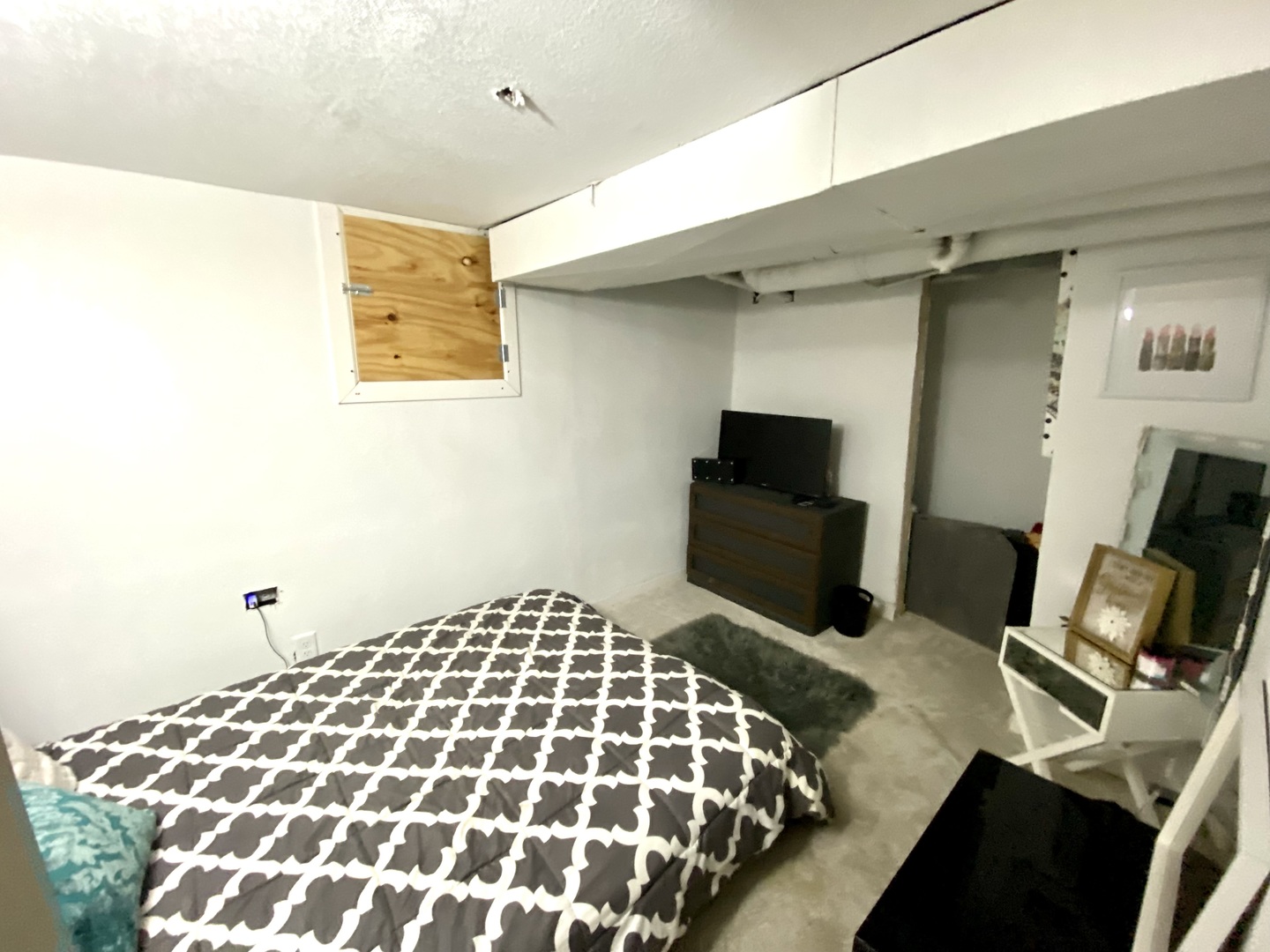 1124 West Cushing Street Decatur, IL 62526 - Photo 22 of 31 a bedroom with a bed and flat screen tv