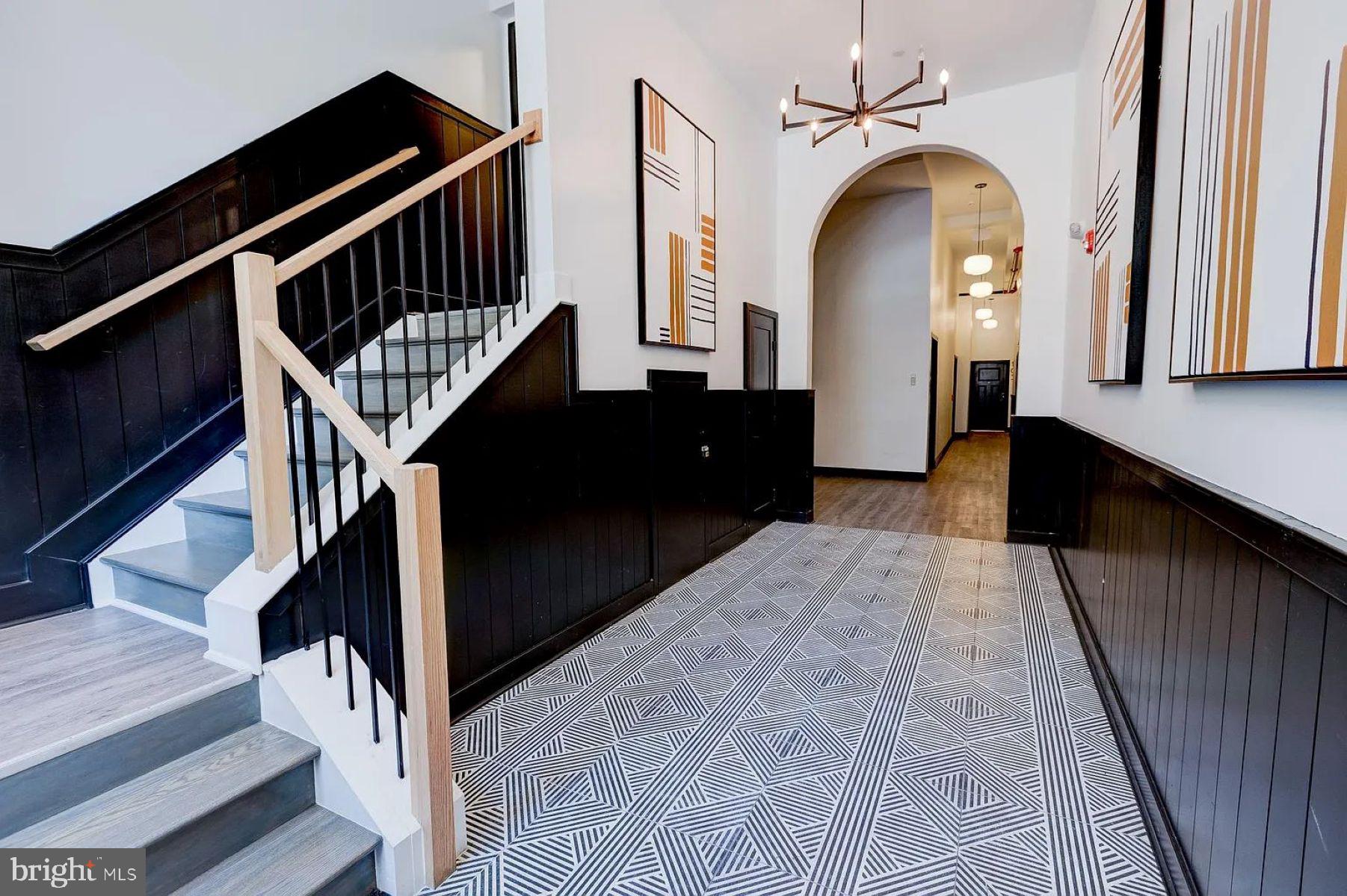211 St Paul Street, Unit 504 Baltimore, MD 21202 - Photo 11 of 12 a view of entryway and hall with wooden floor
