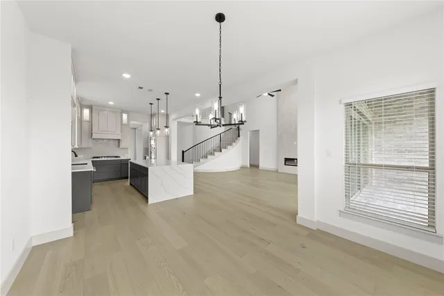 a view of a kitchen with furniture and a chandelier