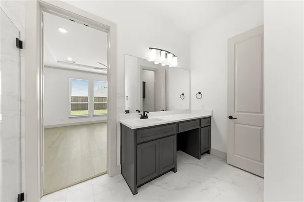 a spacious bathroom with a double vanity sink mirror and double