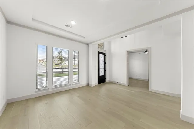 a view of an empty room with a window