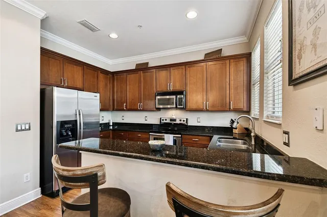 a view of staircase with wooden floor and white walls