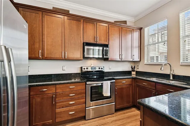 a en suite bathroom with a sink a mirror and a bathtub