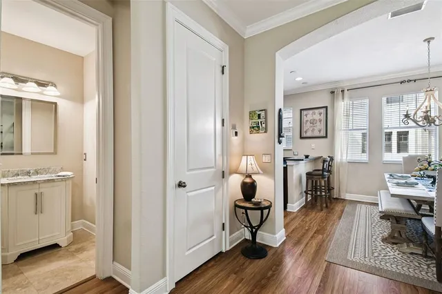 a bedroom with a large bed and a flat tv screen on dresser