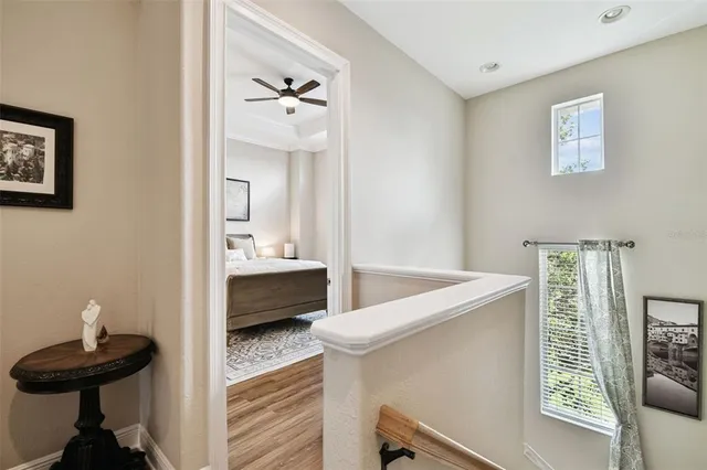 a spacious bathroom with a granite countertop sink a large mirror and a