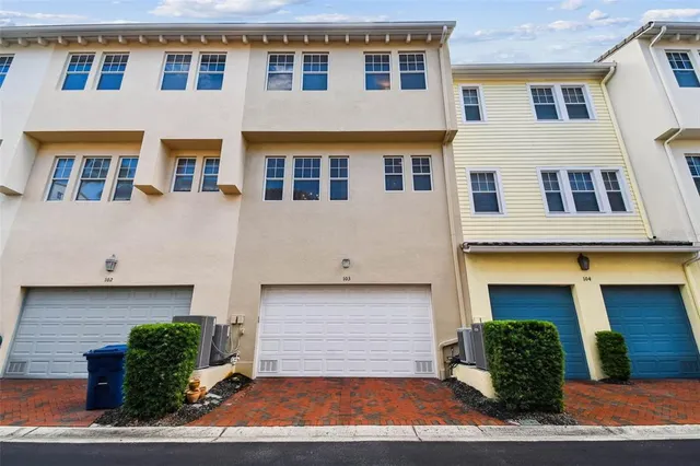 an aerial view of a house with outdoor space swimming pool and ocean view