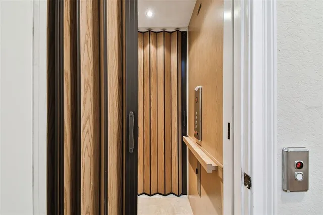 a view of entryway with wooden floor and window