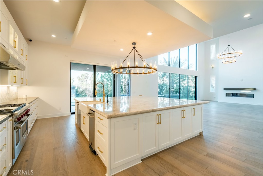 20043 Mersey Lane Porter Ranch, CA 91326 - Photo 13 of 68 a very nice looking room with wooden floor and a large window