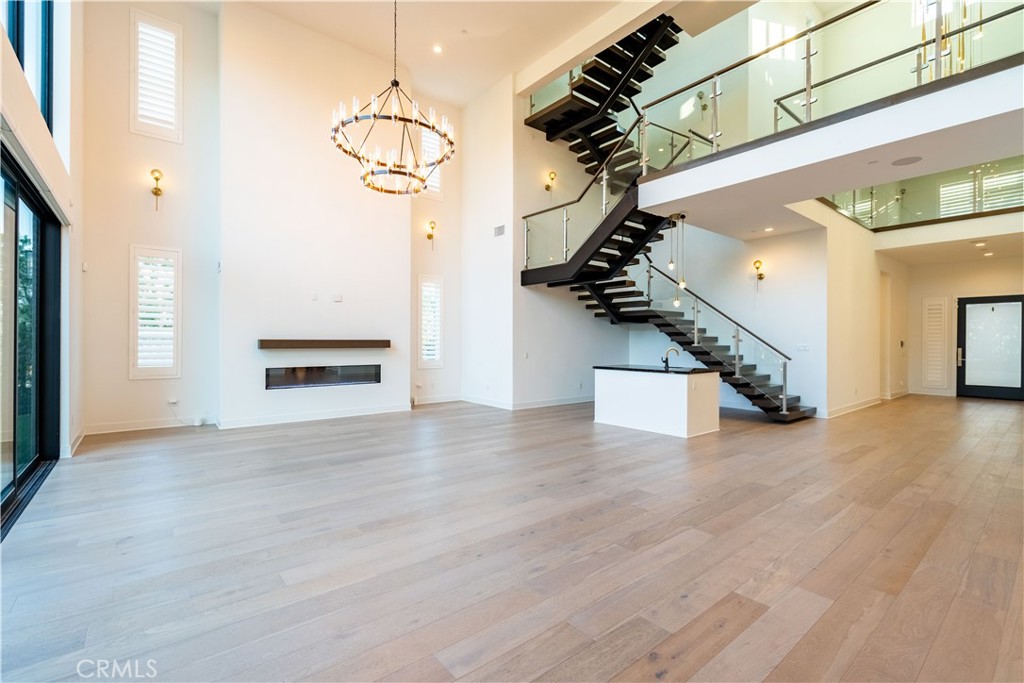 20043 Mersey Lane Porter Ranch, CA 91326 - Photo 15 of 68 a view of a hallway with wooden floor and staircase