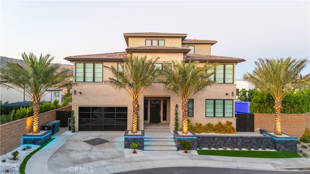 20043 Mersey Lane Porter Ranch, CA 91326 - Photo 2 of 68 a front view of a house with garden