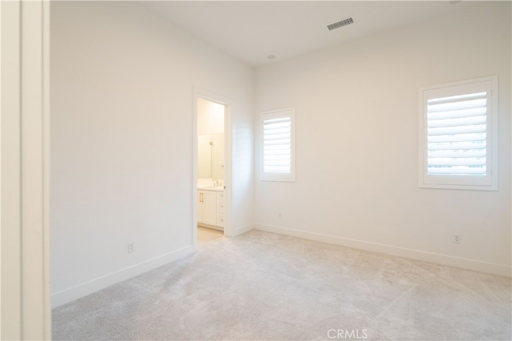 20043 Mersey Lane Porter Ranch, CA 91326 - Photo 25 of 68 an empty room with windows and closet