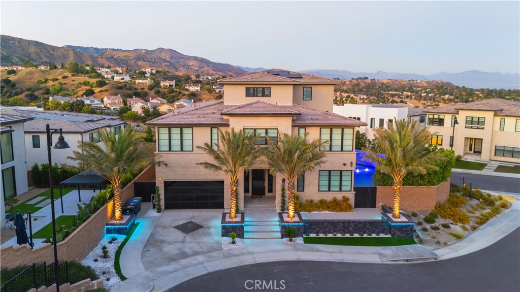 20043 Mersey Lane Porter Ranch, CA 91326 - Photo 3 of 68 a front view of house with yard and green space