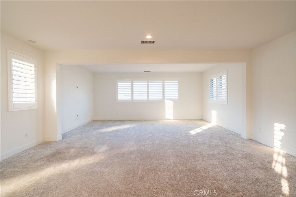 20043 Mersey Lane Porter Ranch, CA 91326 - Photo 36 of 68 an empty room with windows and closet