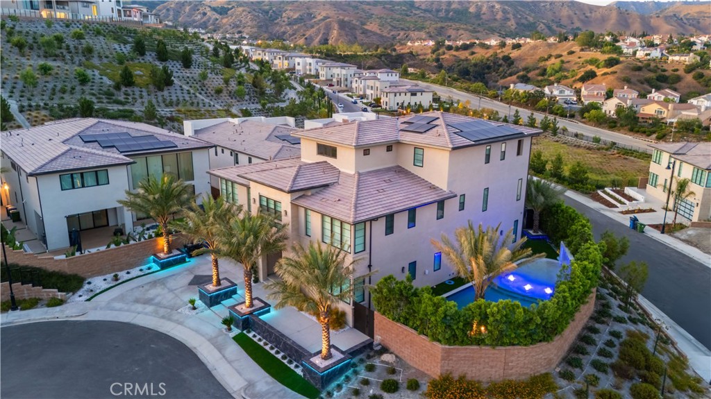 20043 Mersey Lane Porter Ranch, CA 91326 - Photo 4 of 68 an aerial view of multiple houses with a yard